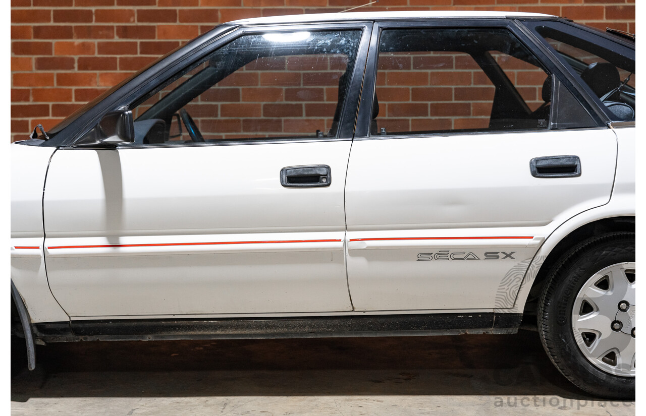 10/1990 Toyota Corolla SX SECA AE93 5d Liftback White 4A-GE 1.6L