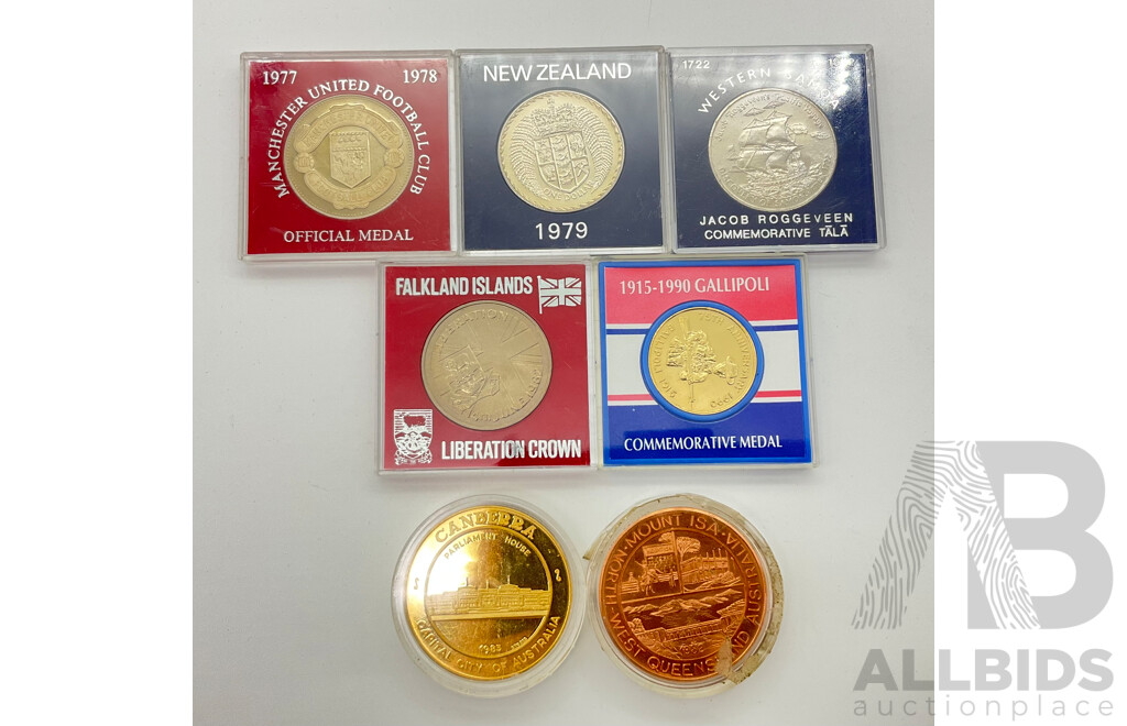 Collection of Commemorative New Zealand, United Kingdom, Falkland Islands and Australia Coins and Medallions Including 1978 Manchester United Football Club Medal, Canberra Tourist Dollar and More