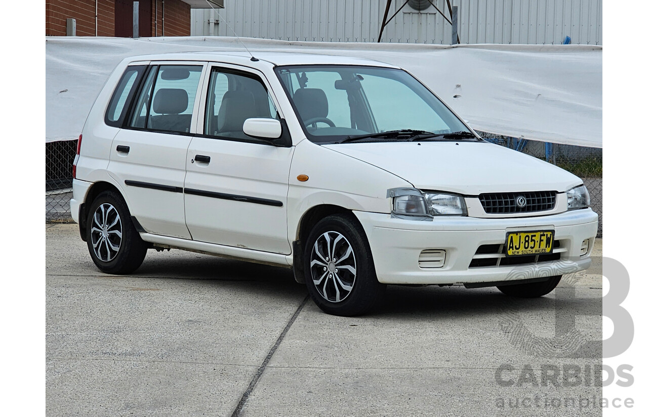 7/1999 Mazda 121 Metro Shades  5d Hatchback White 1.5L