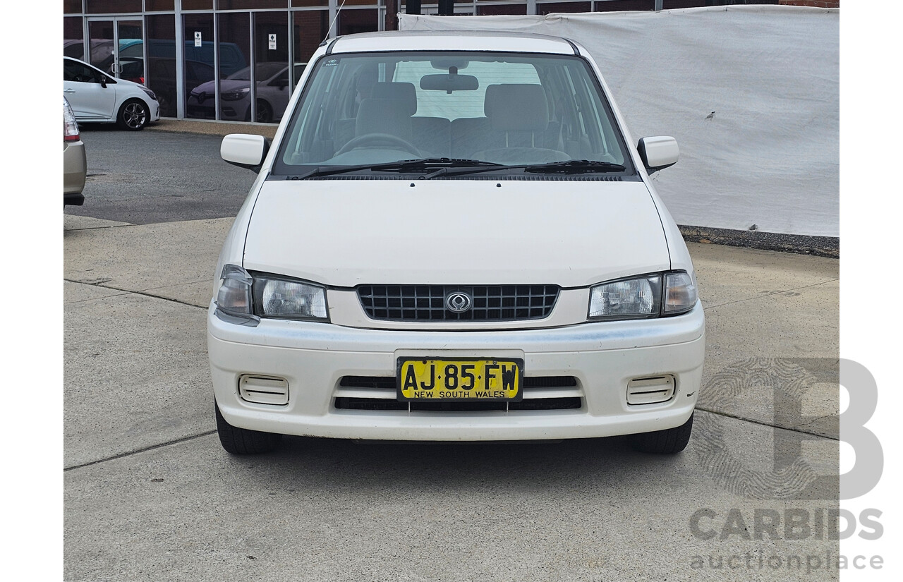 7/1999 Mazda 121 Metro Shades  5d Hatchback White 1.5L