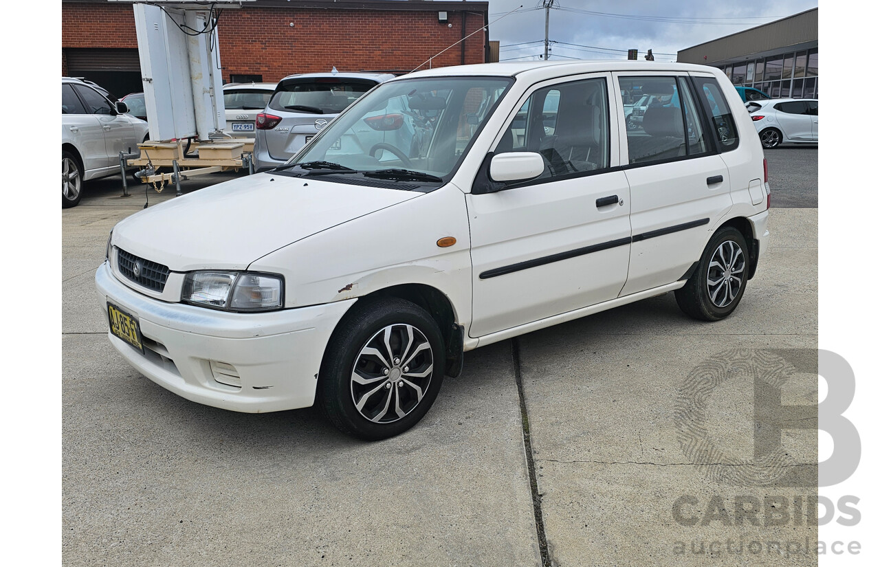 7/1999 Mazda 121 Metro Shades  5d Hatchback White 1.5L