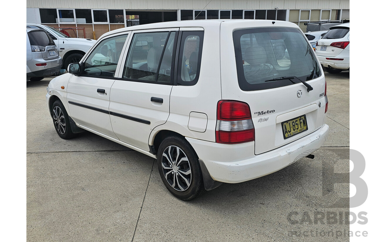 7/1999 Mazda 121 Metro Shades  5d Hatchback White 1.5L