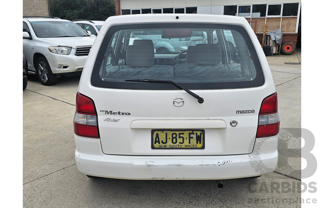 7/1999 Mazda 121 Metro Shades  5d Hatchback White 1.5L