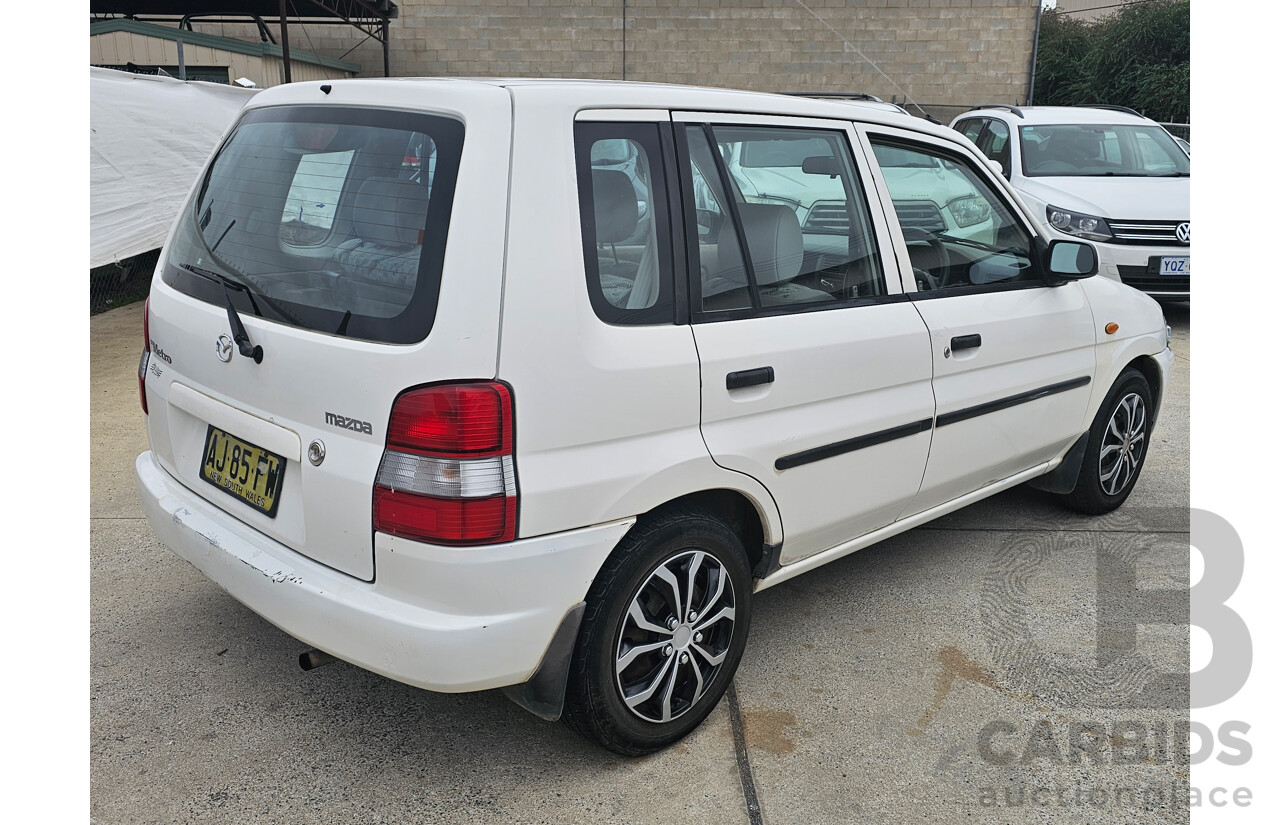 7/1999 Mazda 121 Metro Shades  5d Hatchback White 1.5L