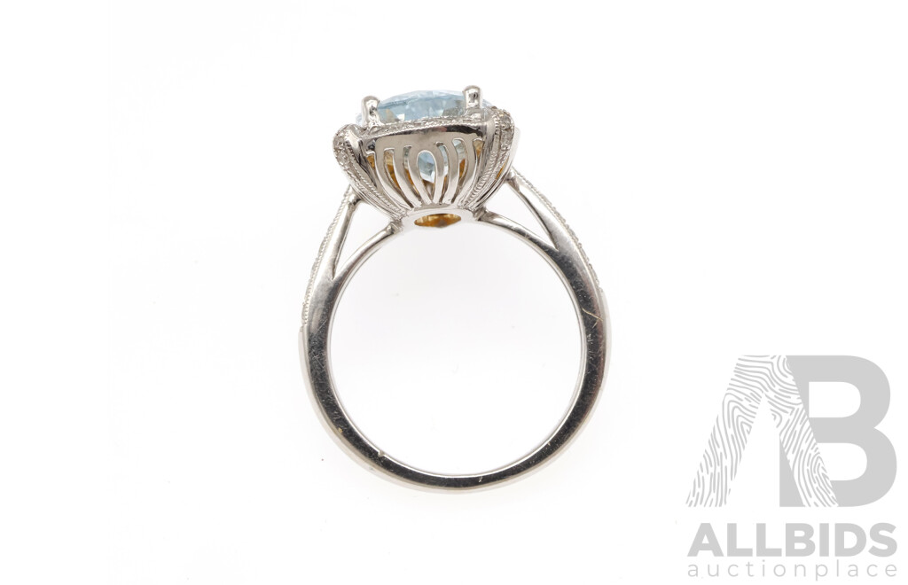 18ct Aquamarine & Diamond Halo Ring, a 4.2ct/TDW 0.41ct, Size N, 6.49 Grams