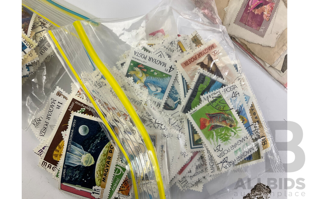 Collection of International Cancelled Stamps Including USSR, North Korea, Hungary, Japan, Australia, Mongolia, Guinea Equatorial, Vietnam, Maldives, Argentina, Madagascar, India and More