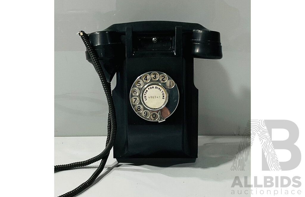 Vintage Wall-mounted Corded Rotary Phone with Some Damaged Wires