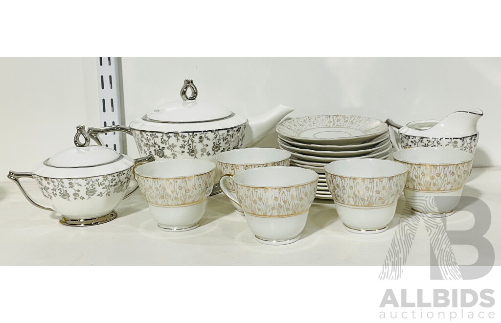 Collection of Assorted Porcelain Tableware Including Teapot, Saucers, Teacups and More