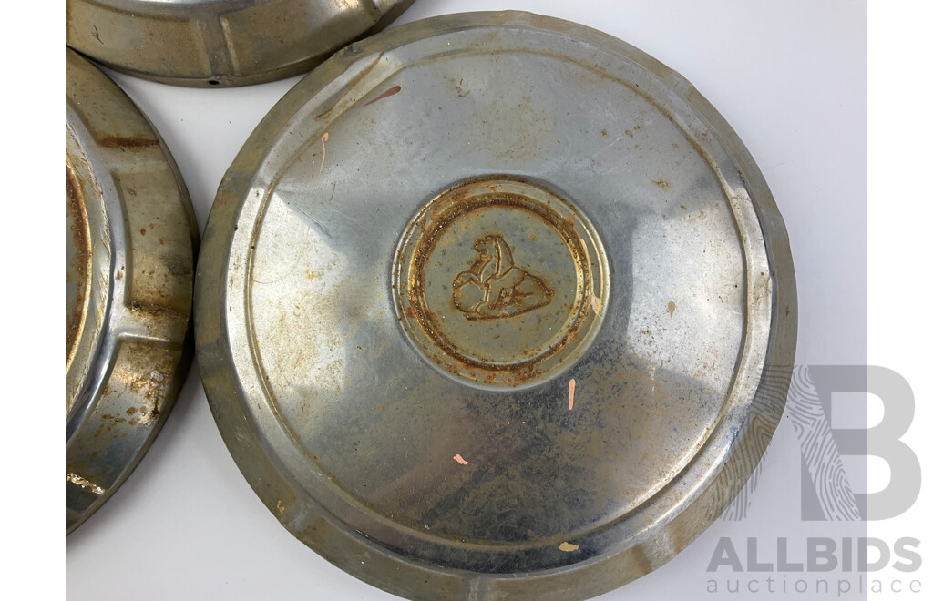 Three Vintage Holden Hubcaps