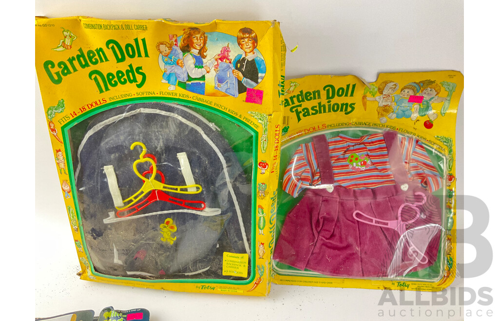 Collection of Vintage Doll Clothing in Original Packets Including Cabage Patch Doll Garden Needs and Rose's Elite Doll's Fashions, Mini-Mod and Pedigree 'The Champions'