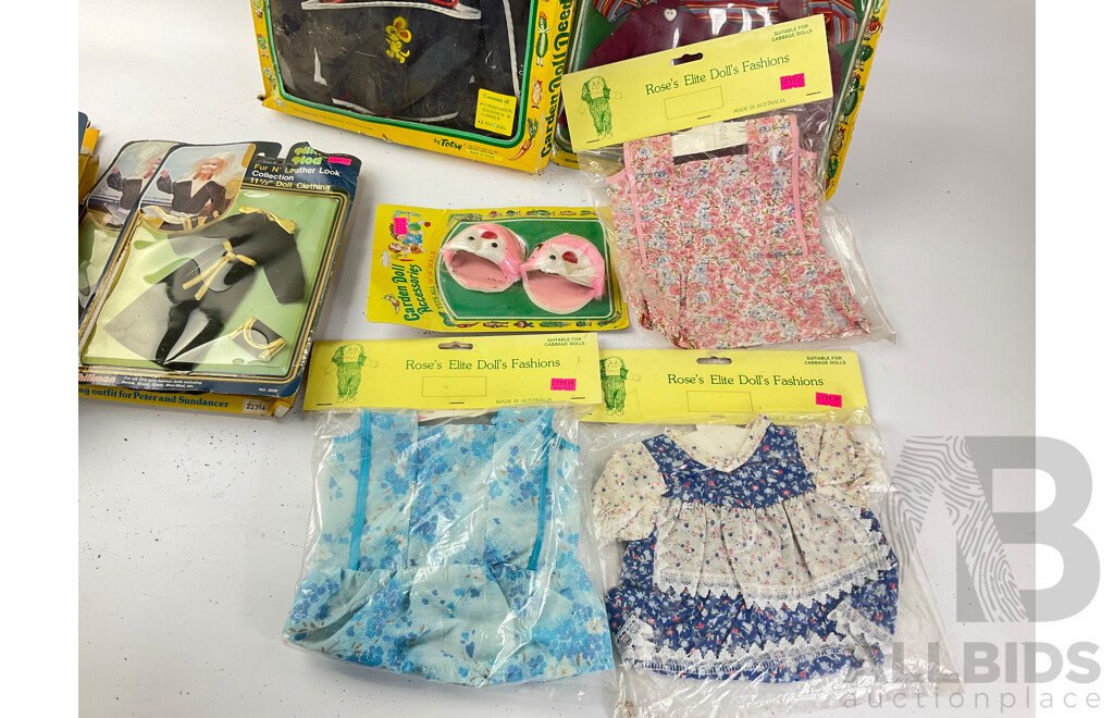 Collection of Vintage Doll Clothing in Original Packets Including Cabage Patch Doll Garden Needs and Rose's Elite Doll's Fashions, Mini-Mod and Pedigree 'The Champions'