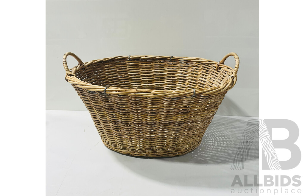 Vintage woven cane laundry basket