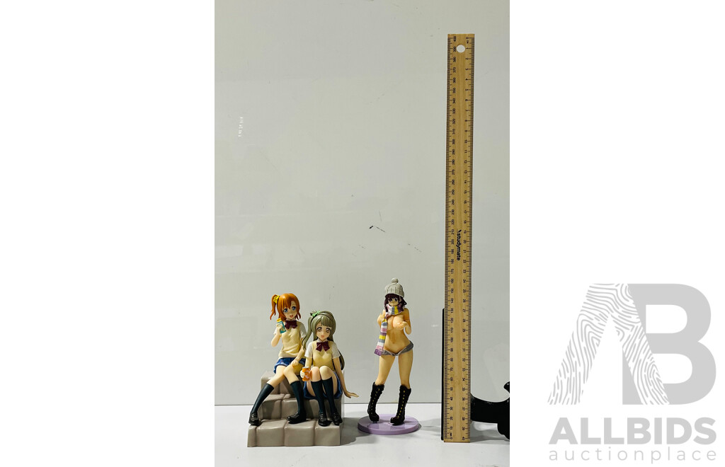 Small Collection of Anime Figures Including Display Base