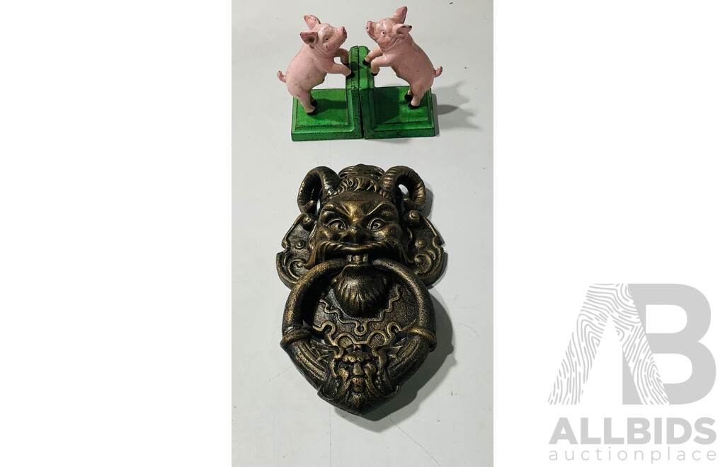 Reproduction Cast Iron Painted Bookends in the Form of Pigs and Demon Form Doorknocker