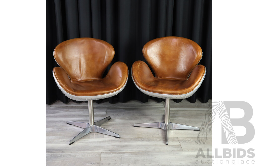 Pair of Swan Style Swivel Chairs with Riveted Alloy Casing