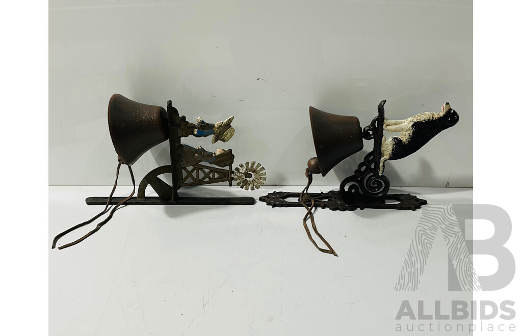 Pair of Cast Iron Reproduction Bells with Decorations Including a Dog and Two Farmers