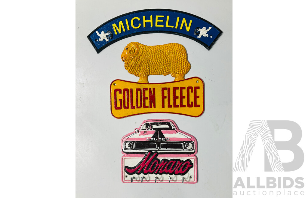 Collection of Three Cast Iron Painted Reproduction Automobilia Signs Including Michelin Tires, Golden Fleece and Holden Monaro