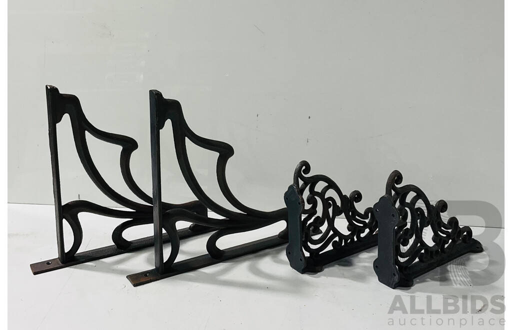 Two Pairs of Cast Iron Wall Mounted Shelving