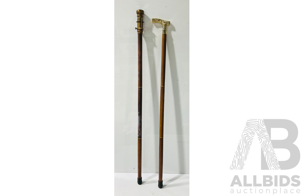 Pair of Wooden Canes Including One with Detailed Metal Hand,e and One with Compass Head
