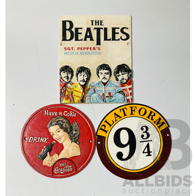 Collection of Three Reproduction Cast Iron Wall Signs Including Platform 9 3/4 Sign, Coca-cola Sign and the Beatles