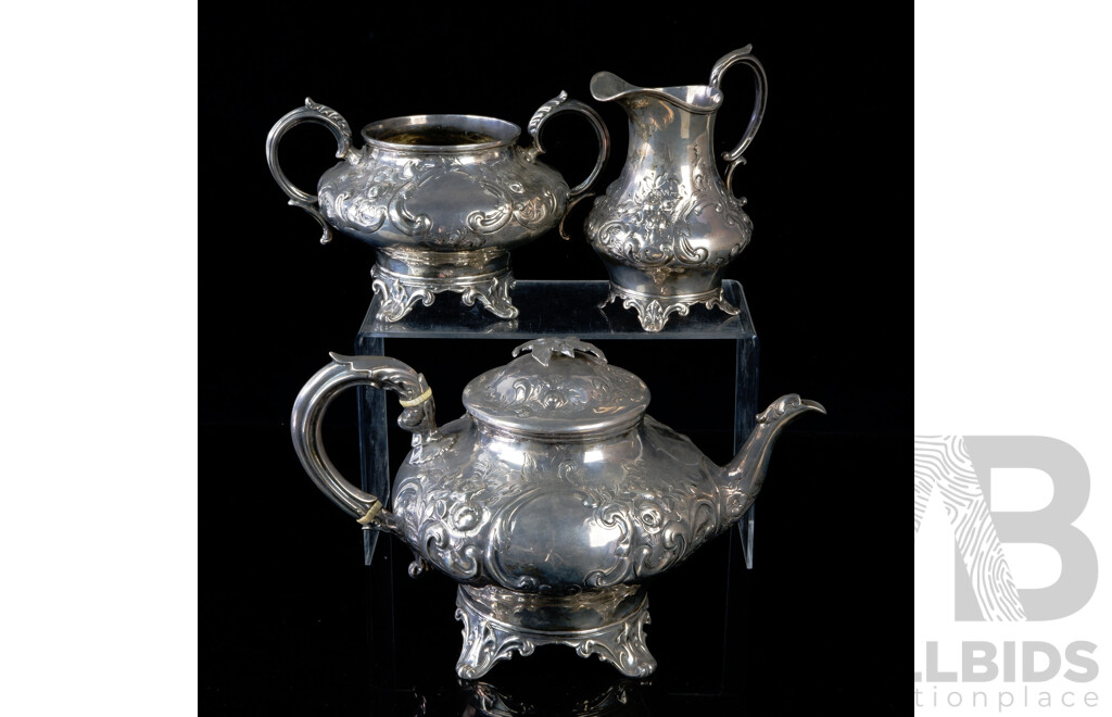 Antique Sterling Silver Three Piece Tea Service with Floral Repoussé Decoration, London, 1868