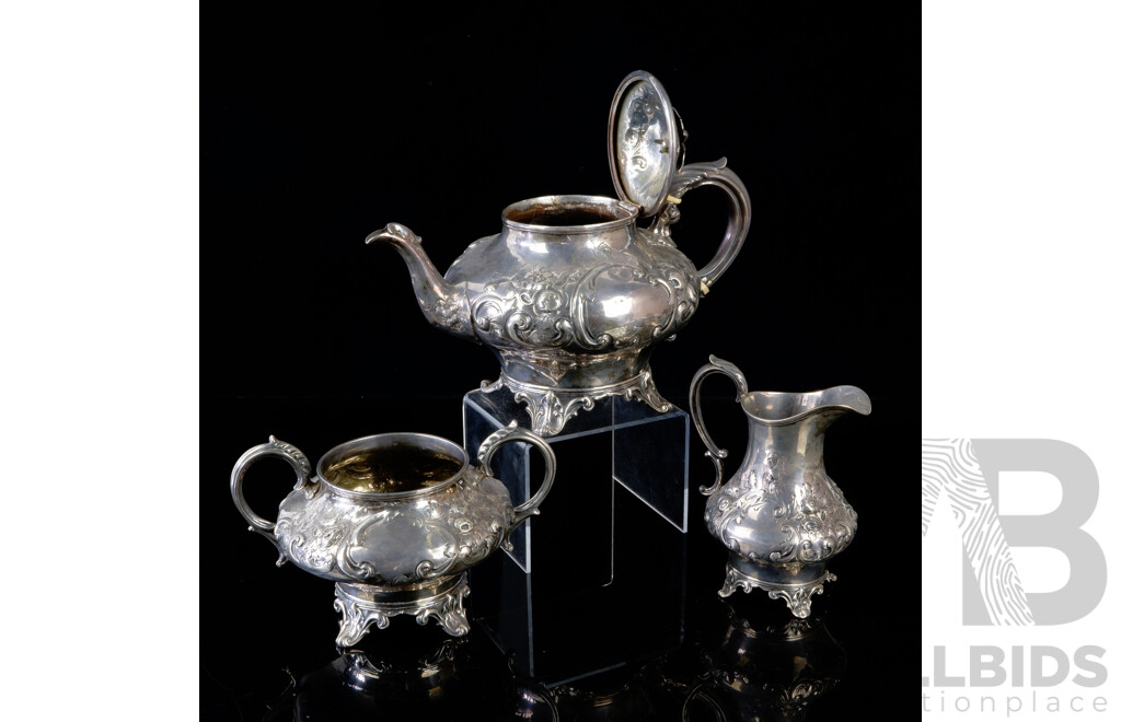 Antique Sterling Silver Three Piece Tea Service with Floral Repoussé Decoration, London, 1868