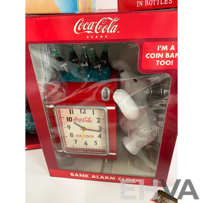 Assortment of Coca Cola Items Including Moulded Wall Clock, Bank Alarm Clock, Diecast Vehicles, Tins, Cups, Collector and Cooking Books