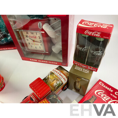 Assortment of Coca Cola Items Including Moulded Wall Clock, Bank Alarm Clock, Diecast Vehicles, Tins, Cups, Collector and Cooking Books