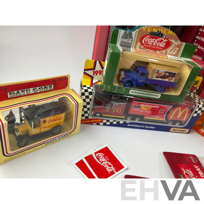 Assortment of Coca Cola Items Including Moulded Wall Clock, Bank Alarm Clock, Diecast Vehicles, Tins, Cups, Collector and Cooking Books