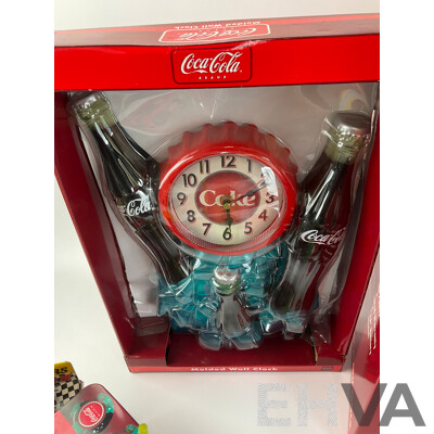 Assortment of Coca Cola Items Including Moulded Wall Clock, Bank Alarm Clock, Diecast Vehicles, Tins, Cups, Collector and Cooking Books