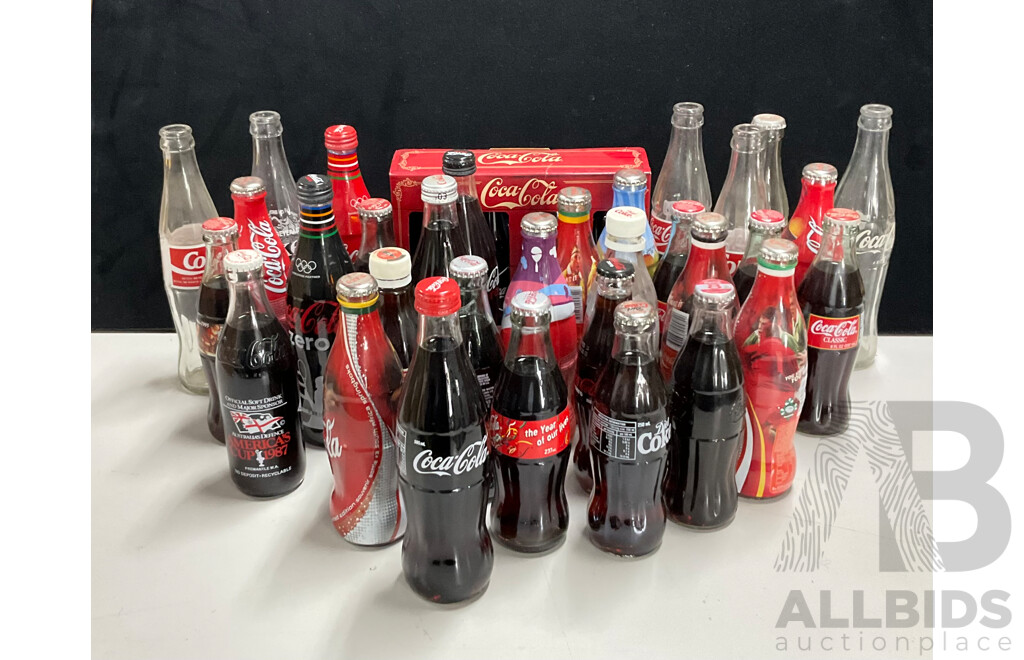 Collection of Vintage and Commemorative Coca Cola Bottles Including Christmas, Olympics and 1987 America's Cup