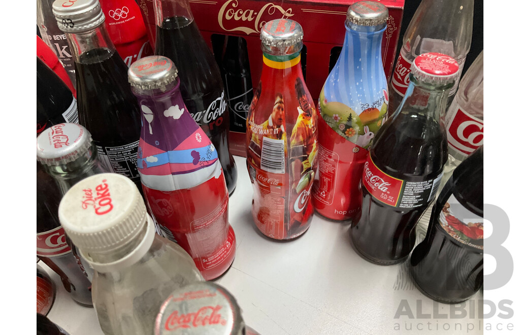 Collection of Vintage and Commemorative Coca Cola Bottles Including Christmas, Olympics and 1987 America's Cup