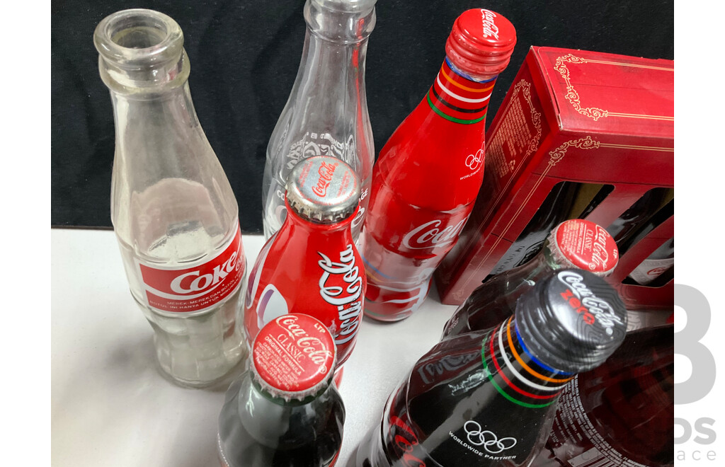 Collection of Vintage and Commemorative Coca Cola Bottles Including Christmas, Olympics and 1987 America's Cup