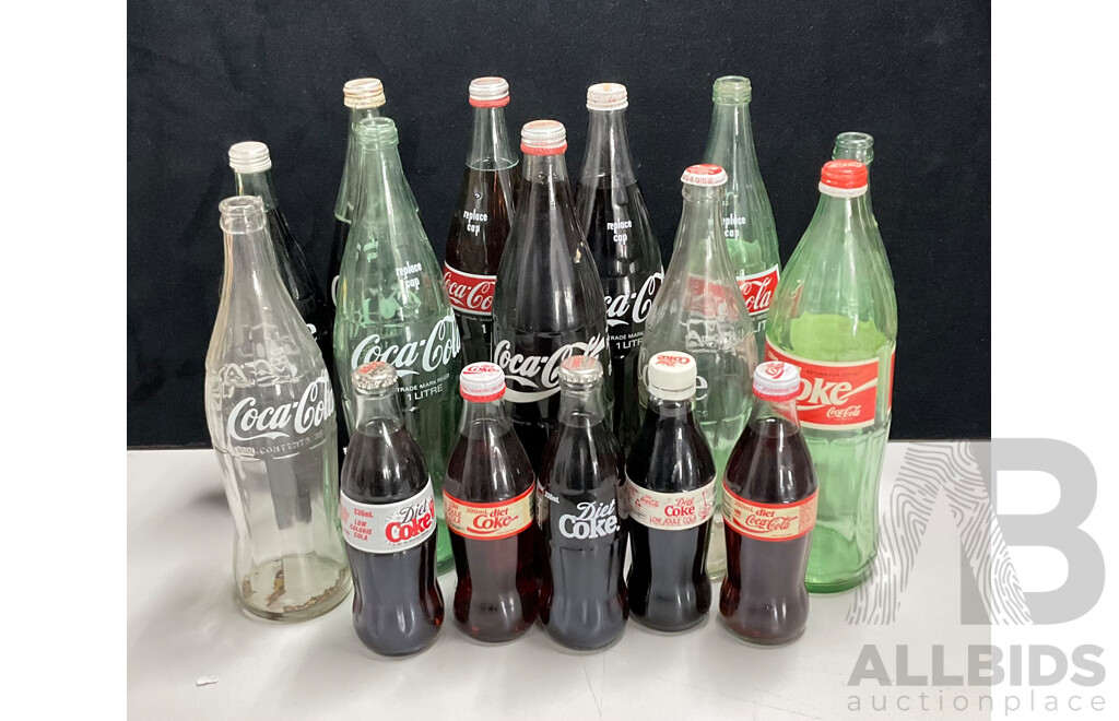 Collection of Vintage Large and Small Glass Coca Cola Bottles