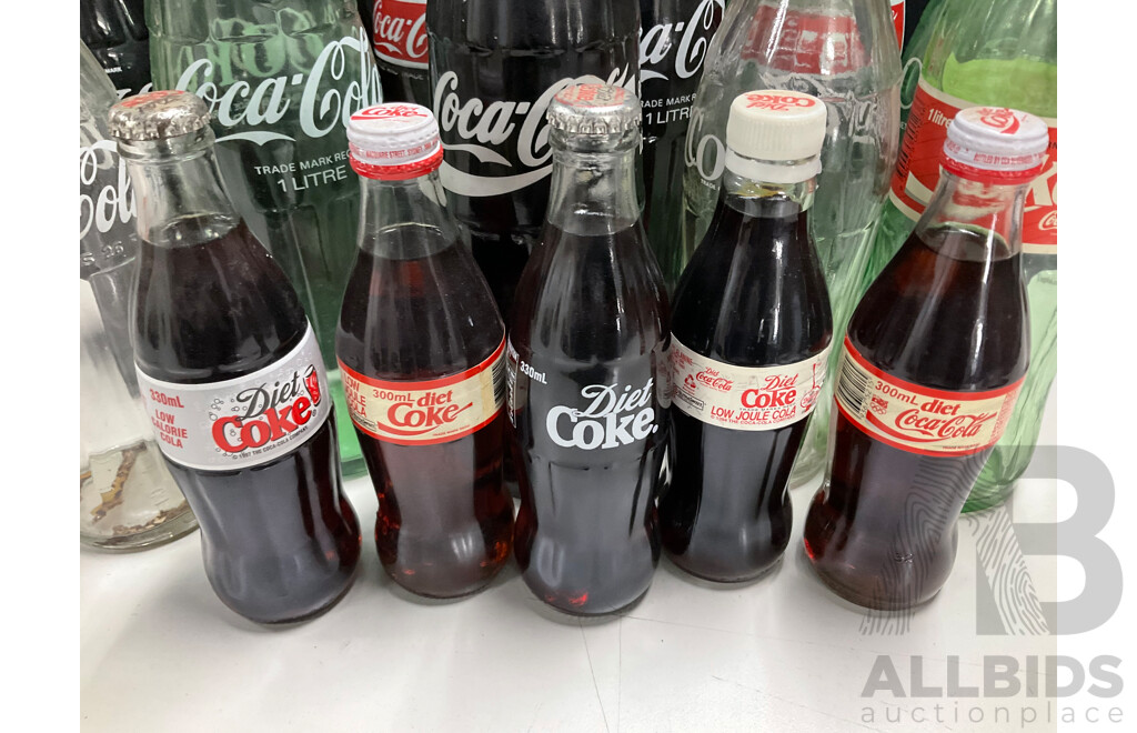 Collection of Vintage Large and Small Glass Coca Cola Bottles