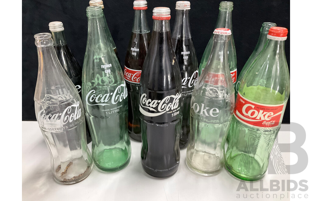 Collection of Vintage Large and Small Glass Coca Cola Bottles