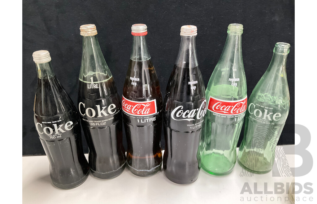 Collection of Vintage Large and Small Glass Coca Cola Bottles