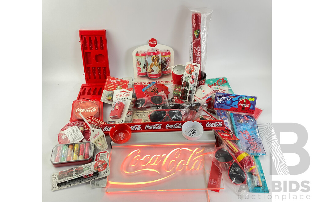 Assortment of Coca Cola Merchandise Including Hanging Illuminated Sign, Lip Smackers, Ice Trays, Pens, Sunglasses, Wallet and More