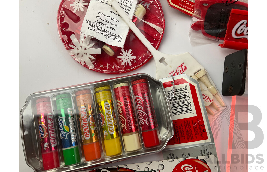 Assortment of Coca Cola Merchandise Including Hanging Illuminated Sign, Lip Smackers, Ice Trays, Pens, Sunglasses, Wallet and More