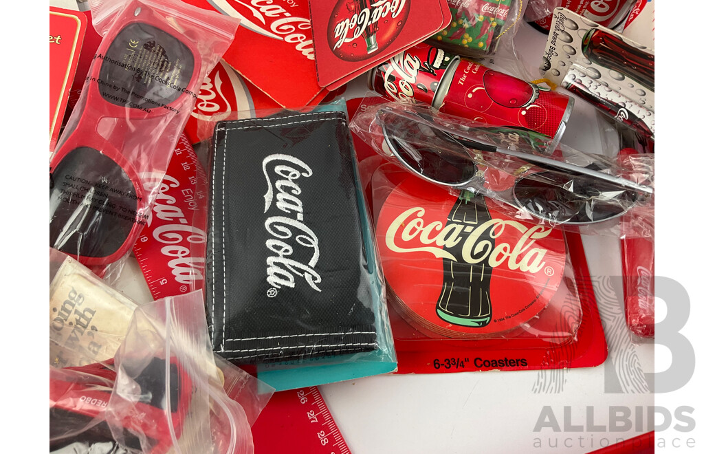 Assortment of Coca Cola Merchandise Including Hanging Illuminated Sign, Lip Smackers, Ice Trays, Pens, Sunglasses, Wallet and More