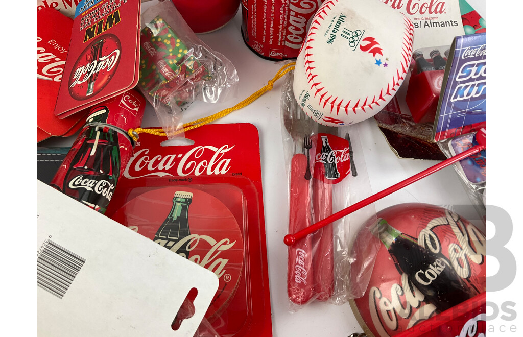 Assortment of Coca Cola Merchandise Including Hanging Illuminated Sign, Lip Smackers, Ice Trays, Pens, Sunglasses, Wallet and More