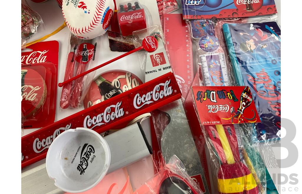 Assortment of Coca Cola Merchandise Including Hanging Illuminated Sign, Lip Smackers, Ice Trays, Pens, Sunglasses, Wallet and More