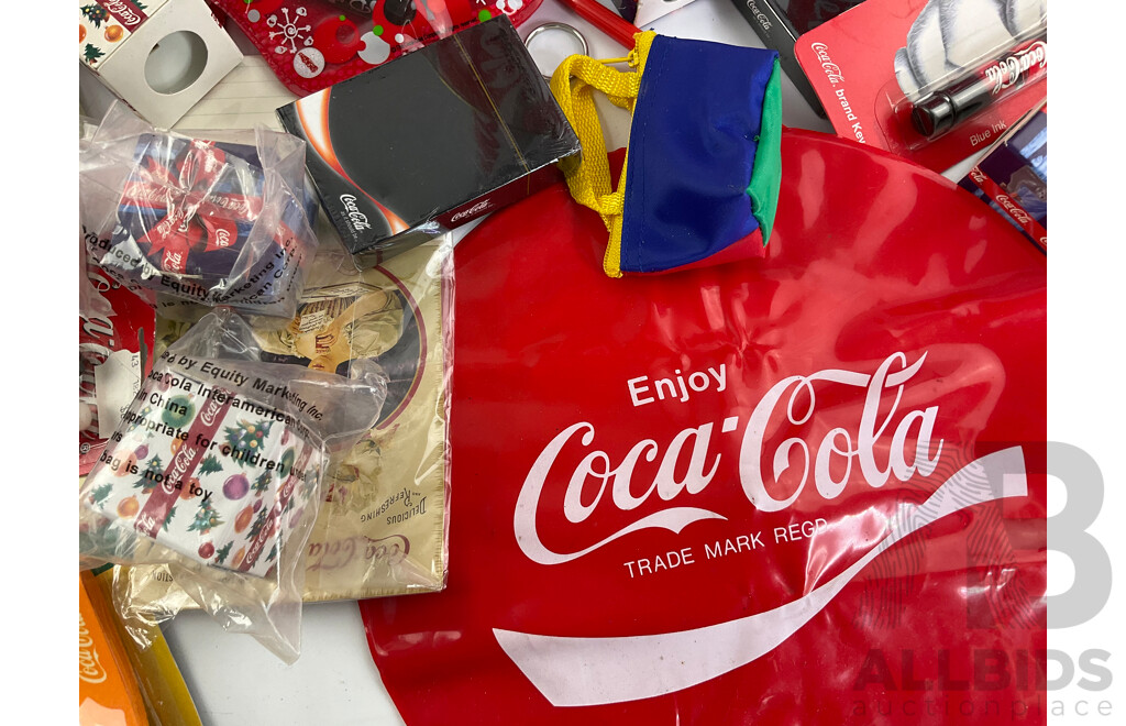 Coca Cola Merchandise Including Vintage Money Tins, Pens, Coasters, Frisbee, Playing Cards, Lip Smackers