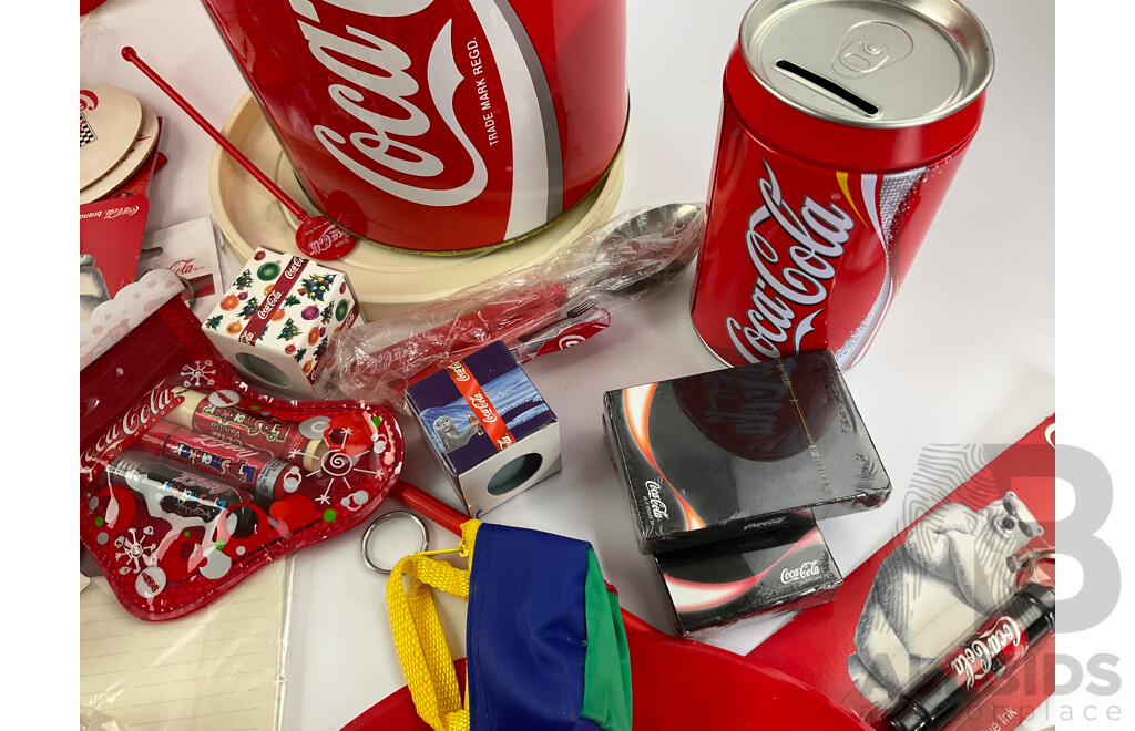 Coca Cola Merchandise Including Vintage Money Tins, Pens, Coasters, Frisbee, Playing Cards, Lip Smackers