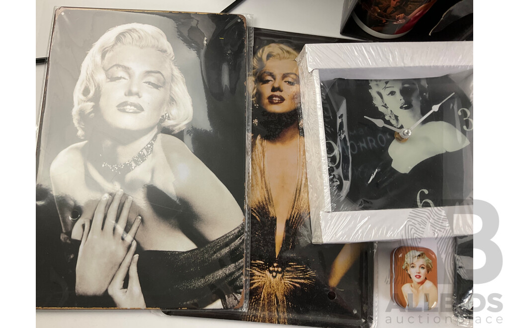 Collection of Marilyn Monroe Memorabilia Including Clock, Statue, Rotating Cylinder, Money Boxes, Cup, Coasters, Tin Plate Hangers, Picture, Calendar