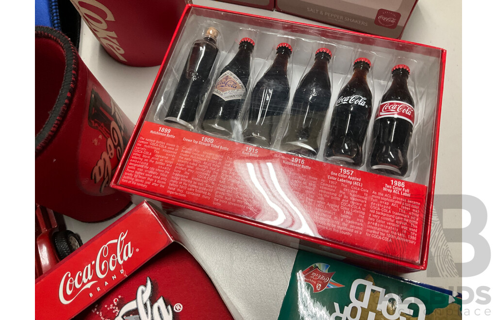 Selection of Coca Cola Merchandise Including Three Boxed Salt and Pepper Shakers, Vintage Sew on Patches and Bottle Openers, Stubbie Coolers, Mini Collector Bottles and More