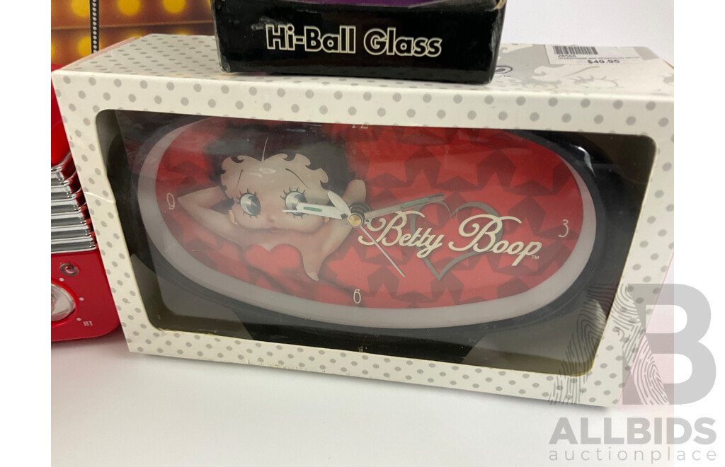 Betty Boop Merchandise Including AM/FM Radio, Wall and Table Clocks, Highball and Shot Glasses, Calendar, Tin Signs