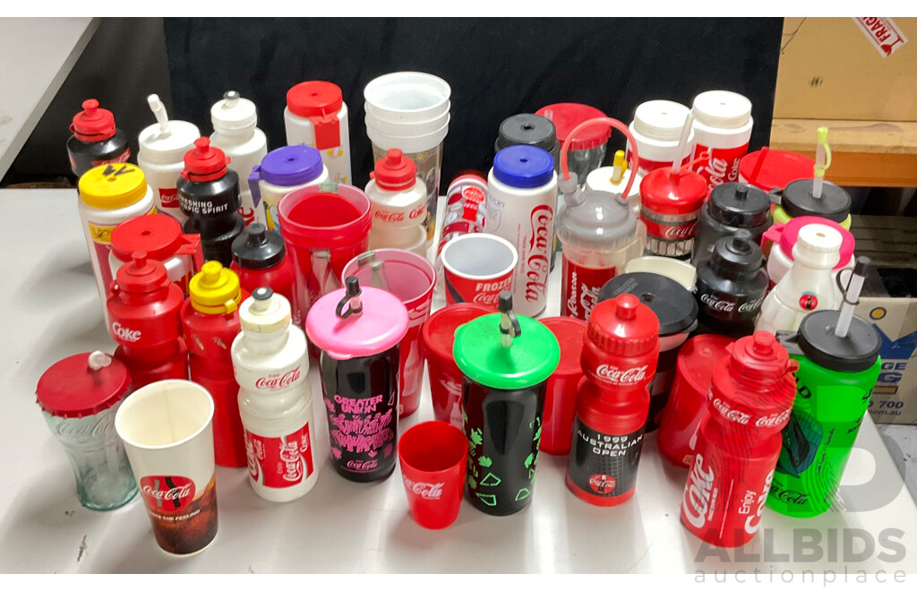 Collection of Coca Cola Sports Drink Bottles and Movie Cups
