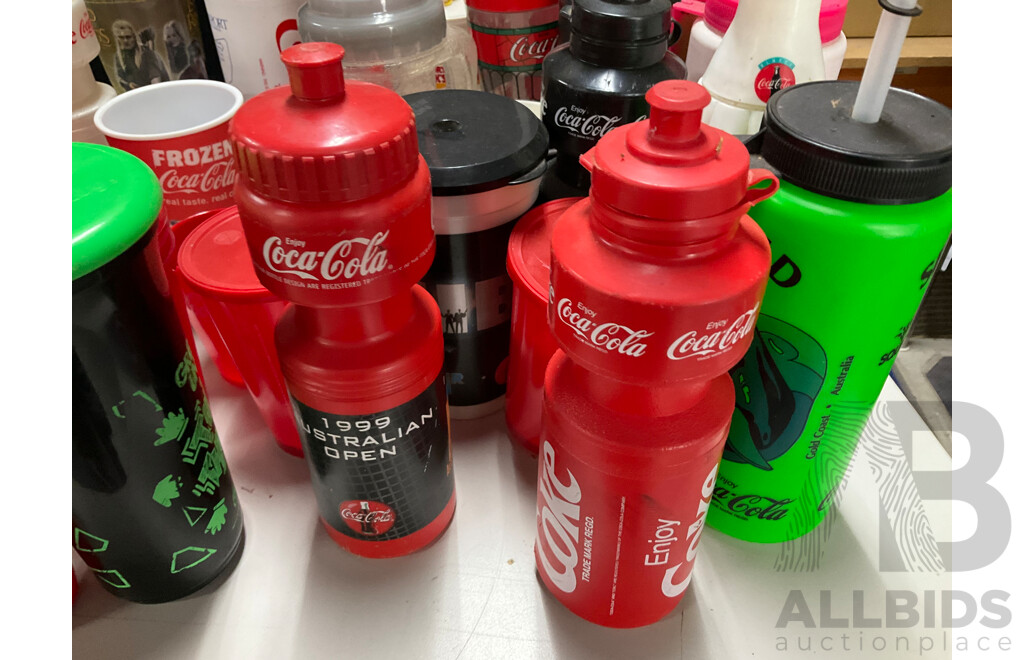 Collection of Coca Cola Sports Drink Bottles and Movie Cups