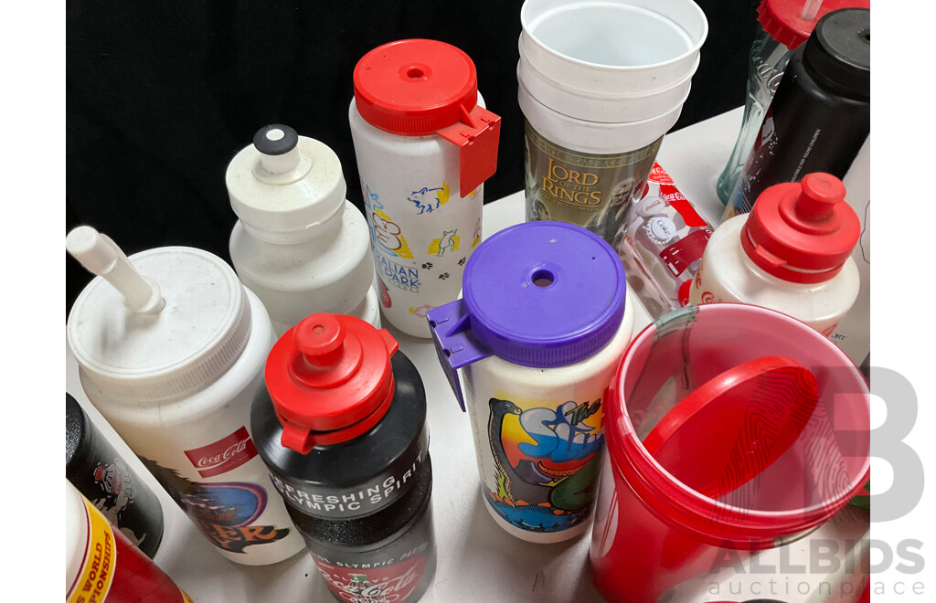 Collection of Coca Cola Sports Drink Bottles and Movie Cups